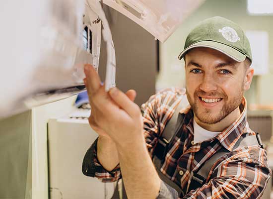 Technician tuning a furnace during an Air Logic heating service visit