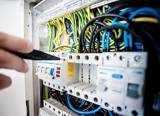 Air Logic technician performing an HVAC maintenance inspection